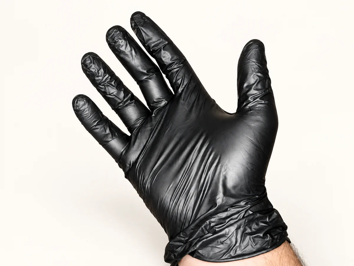 Black disposable vinyl glove