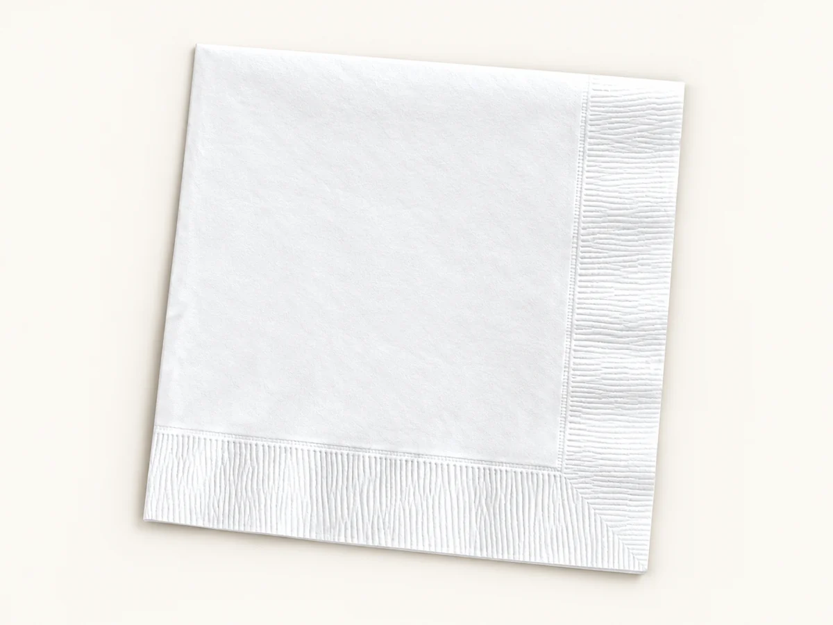 Folded white embossed napkin